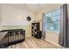 Bright bedroom with charming decor and plenty of natural light, creating a welcoming space at 16320 E Fremont Ave # 1, Aurora, CO 80016