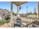 Inviting front porch with charming wicker furniture, perfect for relaxing outdoors at 16320 E Fremont Ave # 1, Aurora, CO 80016