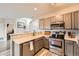 Efficient kitchen with stainless steel appliances and lots of cabinet space and neutral countertops at 16320 E Fremont Ave # 1, Aurora, CO 80016