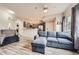 Bright living room with updated flooring, open to the kitchen, and plenty of space to relax at 16320 E Fremont Ave # 1, Aurora, CO 80016