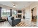 Bright living room with large windows, fireplace, stylish furnishings, and modern flooring at 16320 E Fremont Ave # 1, Aurora, CO 80016
