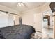 Bedroom with connecting bathroom, updated floors, and generous closet space; plenty of natural light at 16320 E Fremont Ave # 1, Aurora, CO 80016