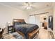 Cozy bedroom with plenty of light and a large bed; the en-suite bathroom is accessible through a sliding door at 16320 E Fremont Ave # 1, Aurora, CO 80016