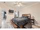 A generous bedroom is filled with natural light and includes an en-suite bathroom and updated flooring at 16320 E Fremont Ave # 1, Aurora, CO 80016
