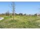 Lush green lawn, mature trees, and pedestrian path create a relaxing environment at 16320 E Fremont Ave # 1, Aurora, CO 80016