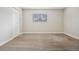 This bright bedroom features a soft carpet, a window and double closet doors at 205 Wright St # 104, Lakewood, CO 80228