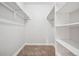 Walk-in closet with shelving and hanging rods, perfect for organizing and storing clothing at 205 Wright St # 104, Lakewood, CO 80228