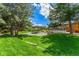 Beautifully landscaped community space with a gazebo and grassy areas for recreation at 205 Wright St # 104, Lakewood, CO 80228