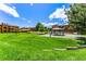 Inviting community space featuring green lawns, a gazebo, and beautifully landscaped areas at 205 Wright St # 104, Lakewood, CO 80228