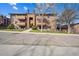 Condominium complex showcases reserved parking and traditional architecture at 205 Wright St # 104, Lakewood, CO 80228