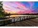 Wooden bridge over serene lake at sunset, offering breathtaking views, perfect for evening strolls at 205 Wright St # 104, Lakewood, CO 80228