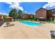 Community pool with lounge chairs, gazebo and well-maintained landscaping at 205 Wright St # 104, Lakewood, CO 80228