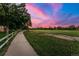Scenic walking path with lush green fields, perfect for leisurely strolls and outdoor enjoyment at 205 Wright St # 104, Lakewood, CO 80228