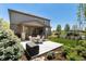 Backyard patio featuring outdoor seating and well-maintained landscaping, ideal for relaxation at 110 Ferris Ln, Erie, CO 80516