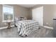 Cozy bedroom featuring neutral colors, a comfortable bed, and plenty of natural light at 110 Ferris Ln, Erie, CO 80516