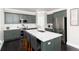 Modern kitchen features stainless steel appliances, a marble island, and sleek cabinetry at 110 Ferris Ln, Erie, CO 80516
