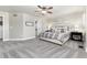Large main bedroom featuring a comfortable bed, ample natural light, and a ceiling fan at 110 Ferris Ln, Erie, CO 80516