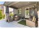 Relaxing outdoor patio with comfortable seating, stone pillars, and easy access to the yard at 110 Ferris Ln, Erie, CO 80516