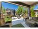 Charming covered patio offering an inviting outdoor living space with picturesque views of a well-maintained yard at 110 Ferris Ln, Erie, CO 80516