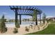 Community pool area with sun loungers and well-maintained landscaping, perfect for summer relaxation at 110 Ferris Ln, Erie, CO 80516