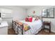 Bright bedroom with a comfortable bed and plenty of natural light at 1800 S Tennyson St, Denver, CO 80219