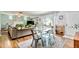 Dining area with glass top table and metal chairs at 1800 S Tennyson St, Denver, CO 80219