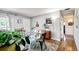 Bright dining area with glass table and hardwood floors at 1800 S Tennyson St, Denver, CO 80219