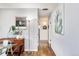 Hallway with hardwood floors and light walls at 1800 S Tennyson St, Denver, CO 80219