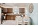 Kitchen with wood cabinets and granite countertops at 1800 S Tennyson St, Denver, CO 80219