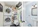 Laundry room with stackable washer and dryer, and shelving at 1800 S Tennyson St, Denver, CO 80219