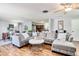 Spacious living room featuring a large sectional sofa and hardwood floors at 1800 S Tennyson St, Denver, CO 80219