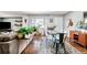 Living room with sectional sofa and wood floors at 1800 S Tennyson St, Denver, CO 80219