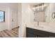 Well-lit bathroom boasts a modern vanity, sleek fixtures, and light-colored walls at 12010 E Harvard Ave, Aurora, CO 80014