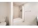 This bathroom has a toilet, a shower/tub combination, and a built-in niche for storage at 12010 E Harvard Ave, Aurora, CO 80014