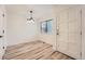 Dining area with hardwood floors, modern lighting, and natural light pouring in at 12010 E Harvard Ave, Aurora, CO 80014
