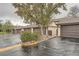 Row of garages for townhomes with mature trees at 12010 E Harvard Ave, Aurora, CO 80014