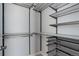 Walk-in closet featuring metal racks, shelving and drawers for optimal storage solutions at 1990 S Holly St # 4, Denver, CO 80222