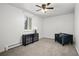 Simple bedroom with carpeting, a mirrored dresser, and a ceiling fan at 8060 W 9Th Ave # 204, Lakewood, CO 80214