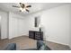 Bright bedroom with double closet, a ceiling fan, and a mirrored sideboard under a window at 8060 W 9Th Ave # 204, Lakewood, CO 80214