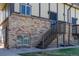 Multi-level exterior showcasing brick facade, stairs to front door, and upper level window at 8060 W 9Th Ave # 204, Lakewood, CO 80214