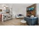 Inviting living room with a brick fireplace, stylish furnishings, and contemporary decor at 8060 W 9Th Ave # 204, Lakewood, CO 80214