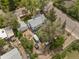 Aerial view of the property, showcasing the layout, surrounding greenery, and proximity to the street at 701 W Quincy Ave, Englewood, CO 80110