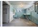 Unfinished basement area with laundry tub and work table at 701 W Quincy Ave, Englewood, CO 80110