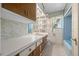 Vintage bathroom features a combination of blue and marble, with a tub and storage at 701 W Quincy Ave, Englewood, CO 80110
