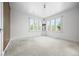 Bright bedroom featuring neutral carpet, fresh paint and vintage corner cabinet at 701 W Quincy Ave, Englewood, CO 80110
