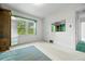 Bright bedroom with light carpet and original details, complemented by natural light at 701 W Quincy Ave, Englewood, CO 80110