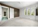 A bedroom boasting light carpet, white walls and natural light from multiple windows at 701 W Quincy Ave, Englewood, CO 80110