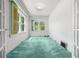 Cozy bedroom bathed in natural light from large windows with white walls at 701 W Quincy Ave, Englewood, CO 80110