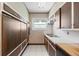 Well-equipped kitchen with modern appliances, white countertops, and tiled flooring at 701 W Quincy Ave, Englewood, CO 80110