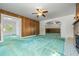 Bright living room featuring wood paneling, archways, and ample natural light at 701 W Quincy Ave, Englewood, CO 80110